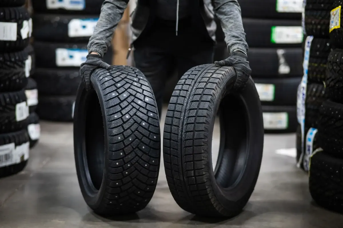 Two winter tires showing their tread patterns
